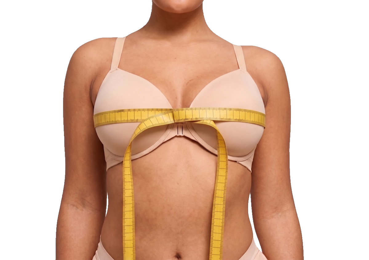 Model demonstrating how to measure around the fullest part of the bust